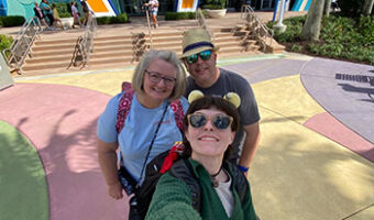 The Research Team taking a selfie in front of the Pop Century sign